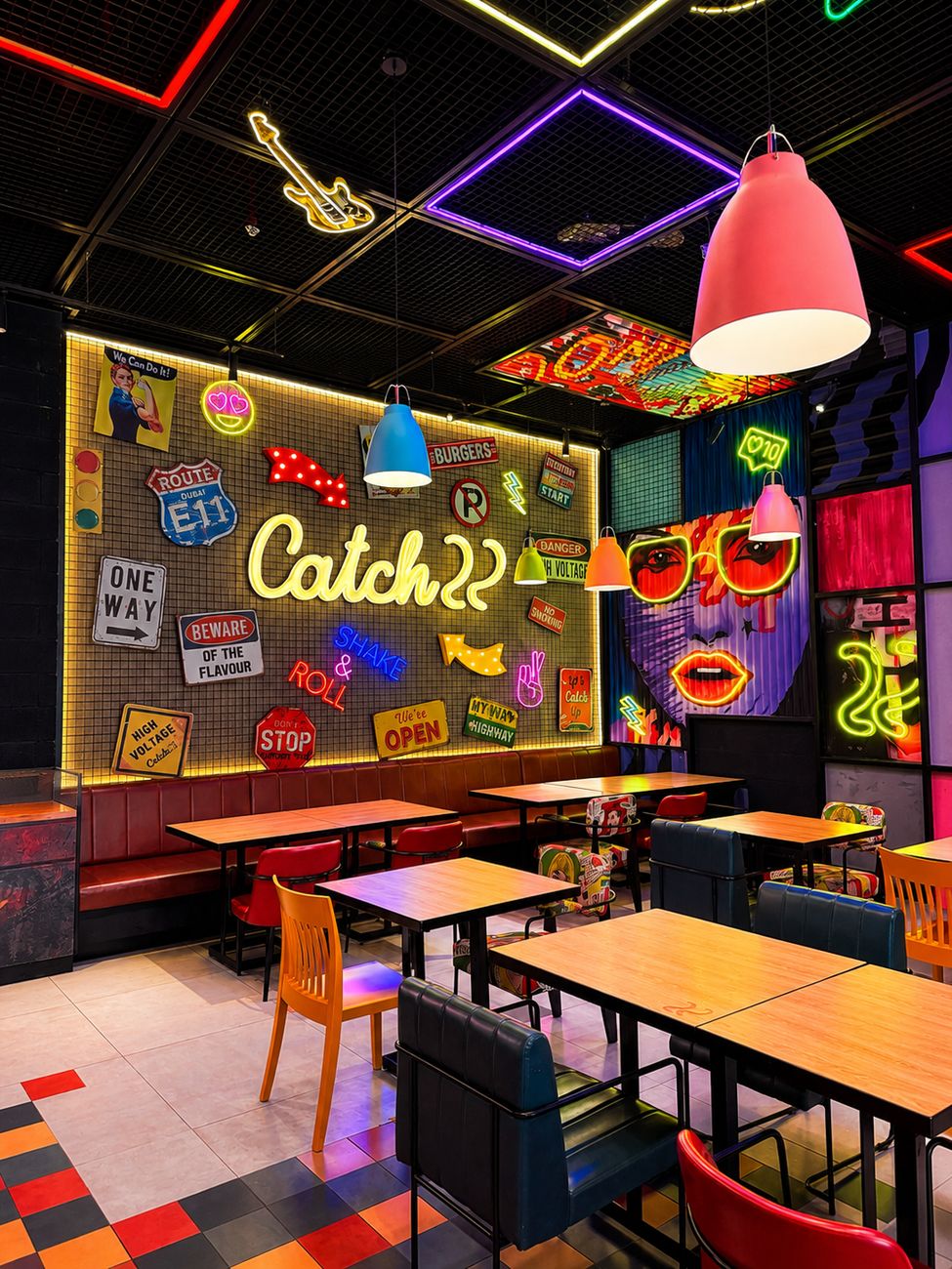 Catch 22 neon signage wall with retro decor and booth seating, Mirdiff City Centre