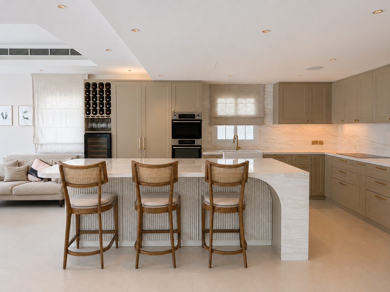 Bespoke JVT villa kitchen island with bar seating by Davies Group UAE
