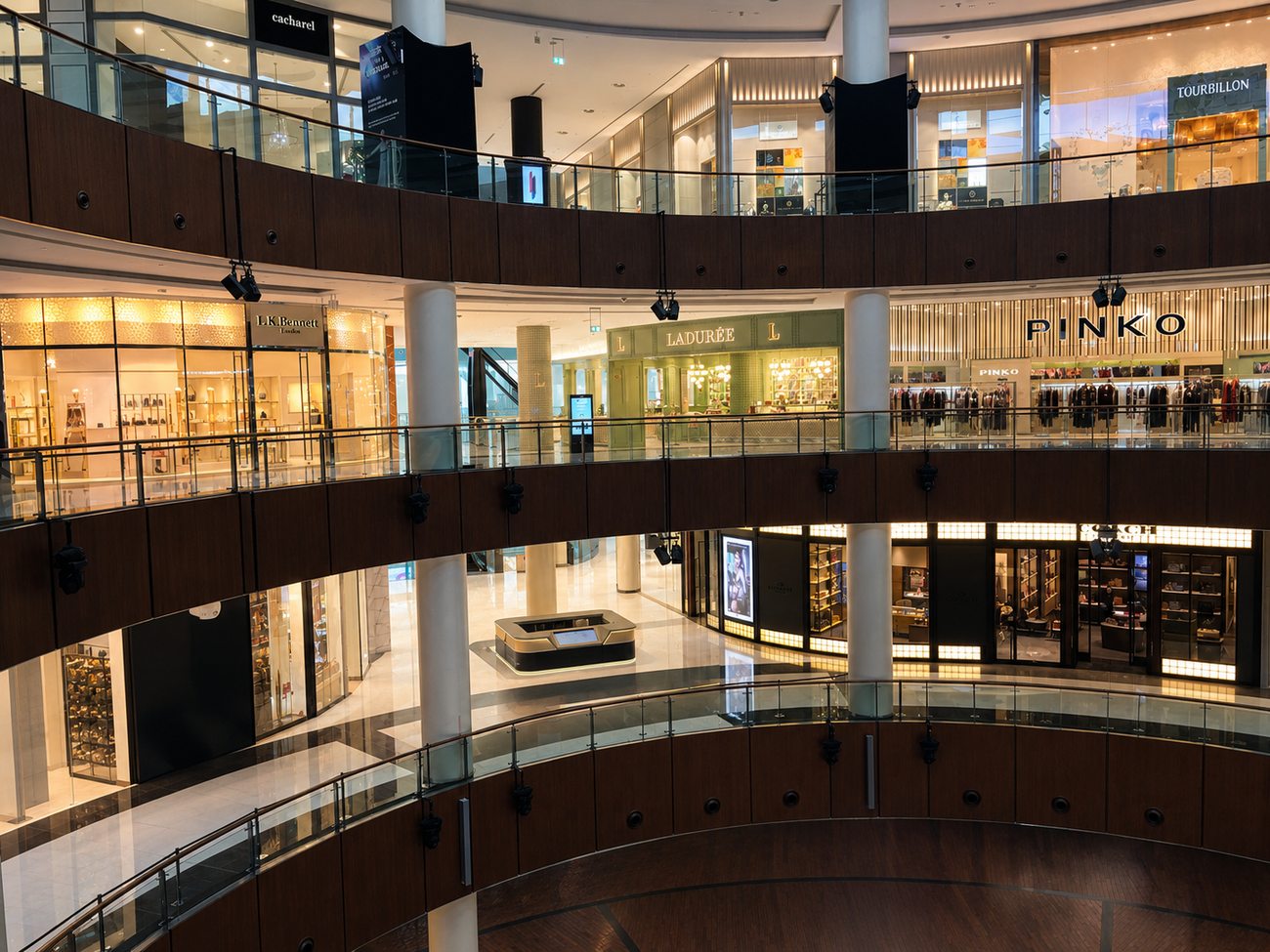 Laduree mall atrium wide view with storefront signage, The Dubai Mall