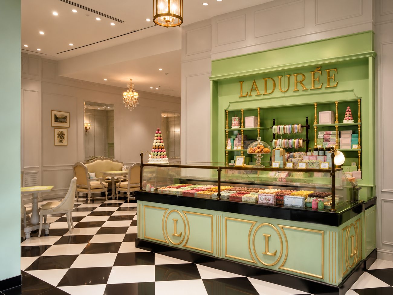 Laduree storefront counter wide view with macaron pyramid display, Mall of the Emirates