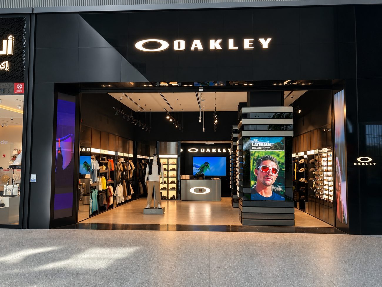 Oakley storefront entrance wide view with campaign pillar, Jeddah, Saudi Arabia