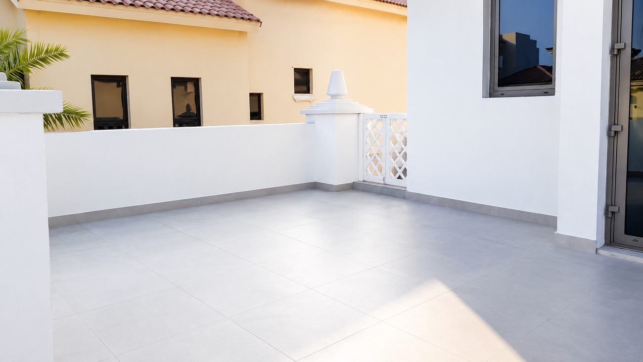Palm villa rooftop terrace with grey tiled finish by Davies Group UAE