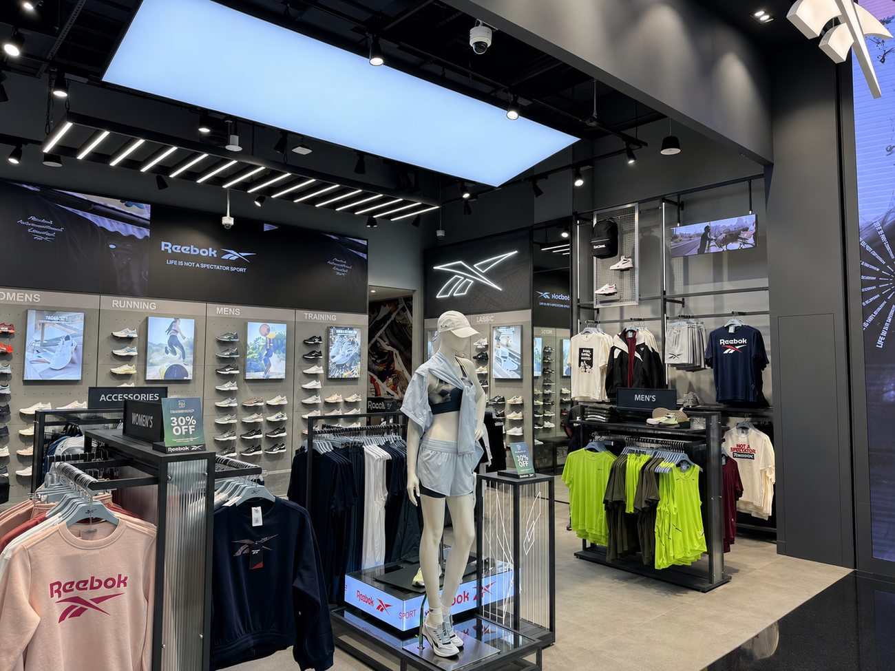 Reebok interior accessories table and neon Vector wall, Mall of the Emirates