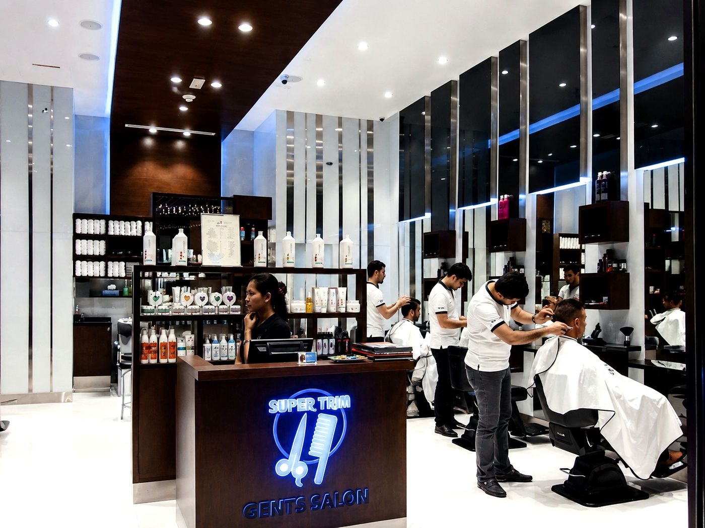 Super Trim Gent's Salon barbers at work by Davies Group UAE